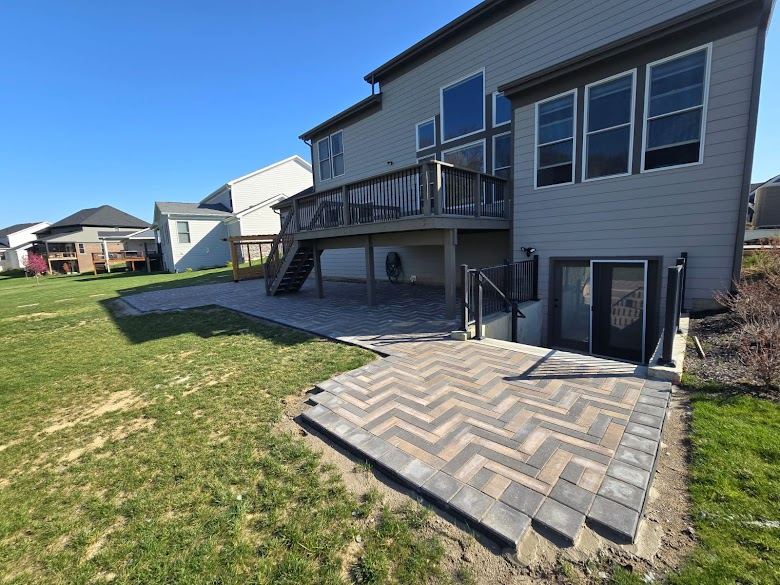 Herringbone pavers set and edged, before pergola and landscaping were added.